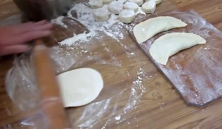 To make chebureks with cheese, roll out the dough