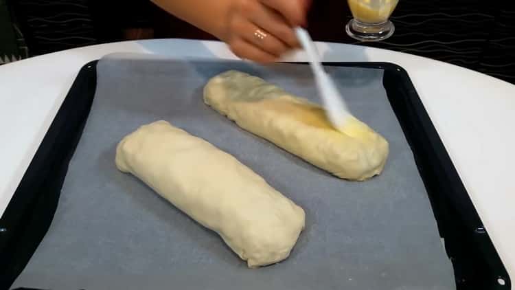 To make puff pastry strudel, grease the egg roll