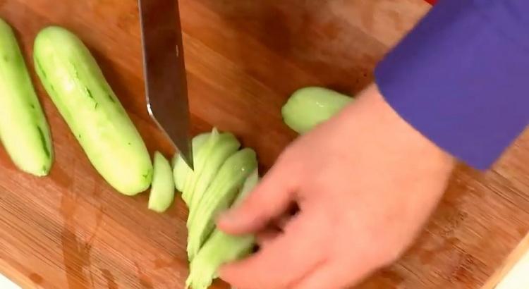 To make a salad, cut a cucumber