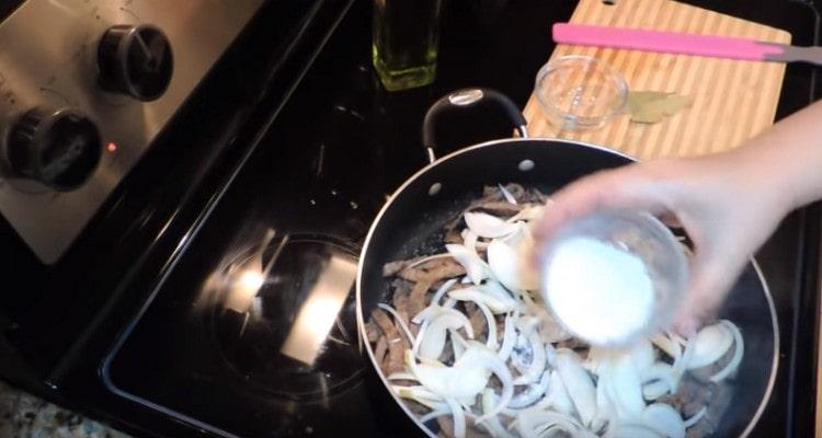 Add onion and flour to the pan.