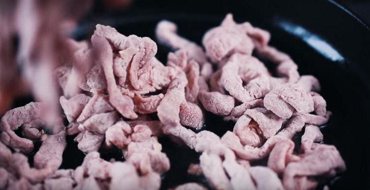 in another pan, fry the meat until golden brown.