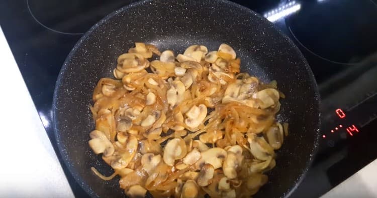 Add mushrooms to the onion and fry until tender.