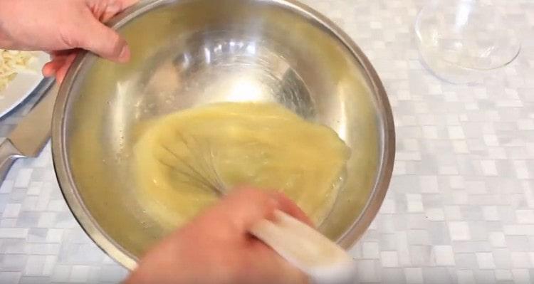 Beat the eggs with a whisk.