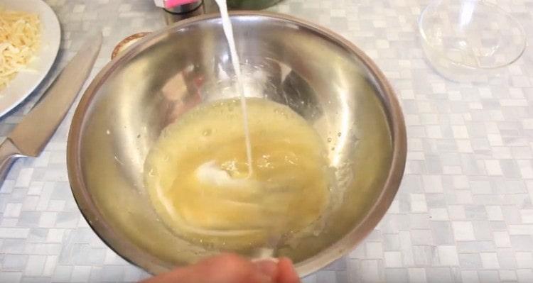 Add cream to the egg mass.