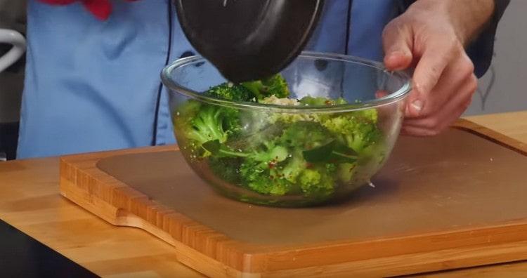 Season broccoli with garlic oil.