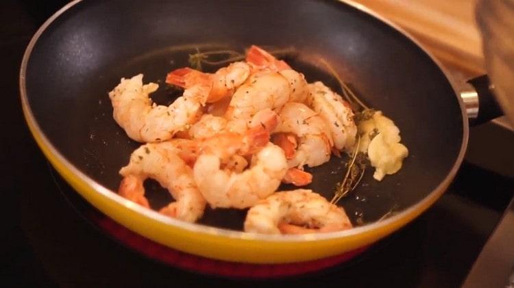 put the shrimp in the pan.