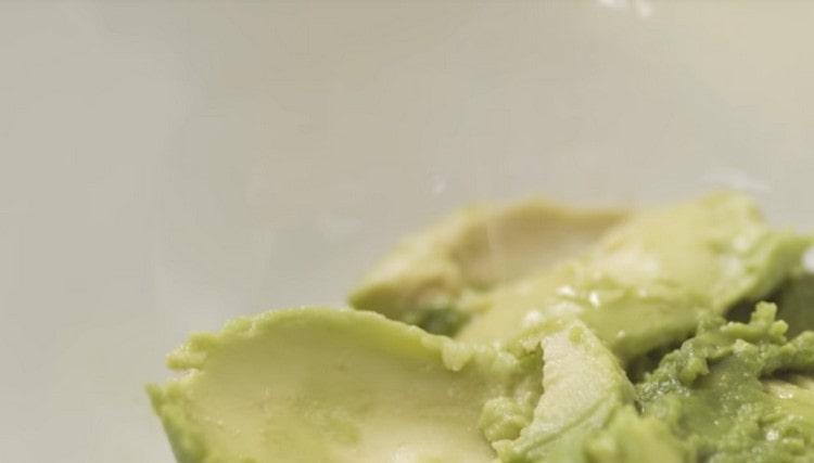 Sprinkle the flesh of an avocado with lime juice.