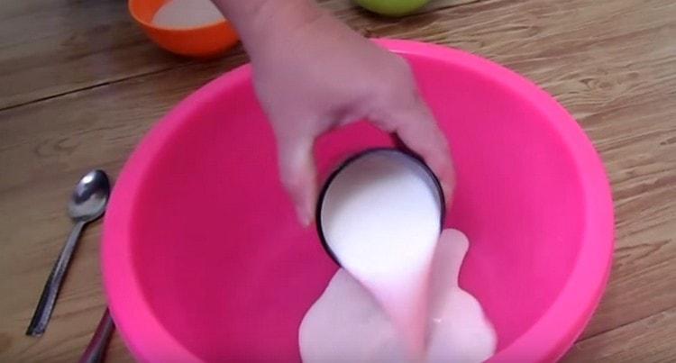 Pour warm kefir into a bowl.