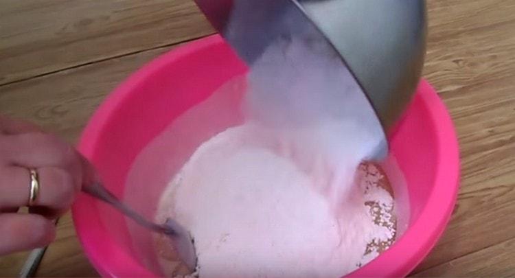 Pour flour into the liquid ingredients.