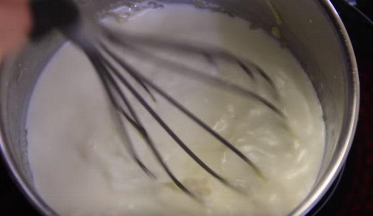 Next, add milk and mix with a whisk.