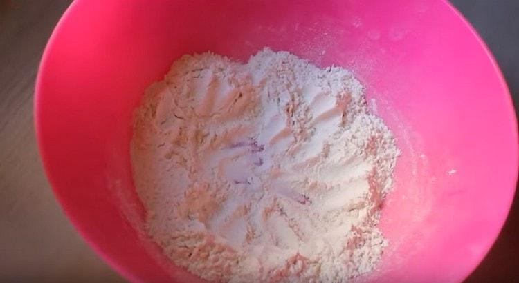 Make a small depression in the flour.