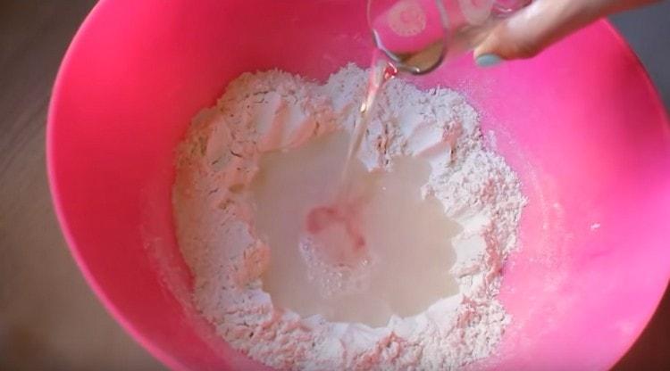 Pour water and vegetable oil into the recess.