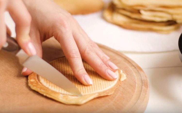 To make Dutch waffles perfect, we cut off the excess dough.