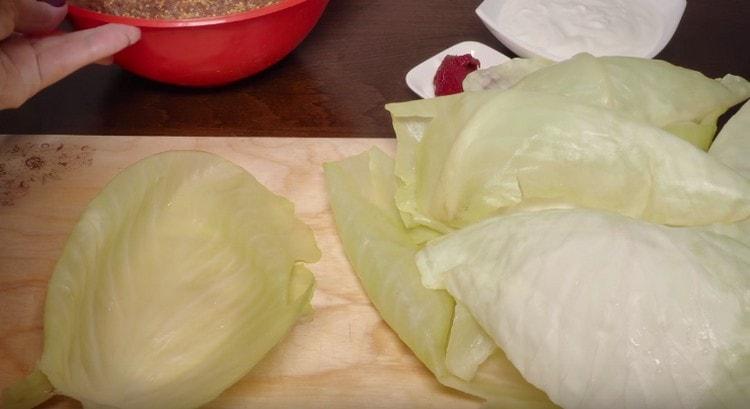 Carefully remove the top sheets from the cabbage.