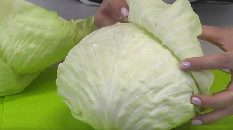 Carefully remove the leaves from the cabbage.