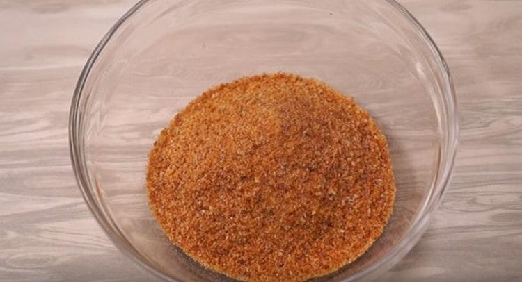 Pour breadcrumbs into a bowl.