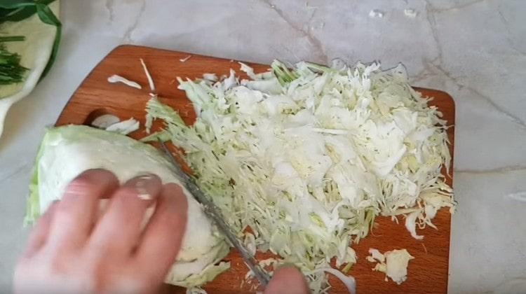 Finely chop the cabbage and add to the minced meat.