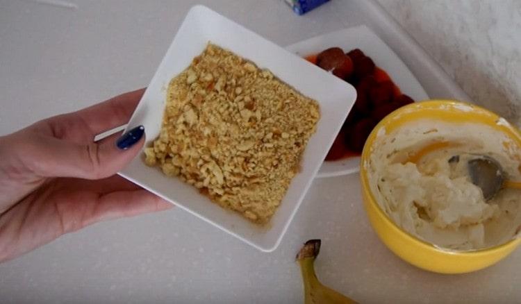 Grind shortbread cookies into crumbs.