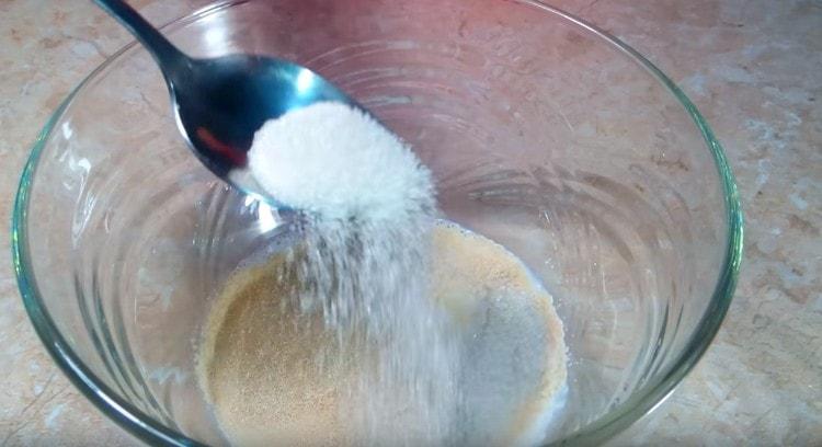 Pour yeast and sugar into warmed milk.