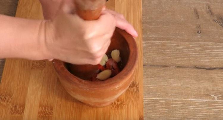 Add salt and grind the ingredients in a mortar.