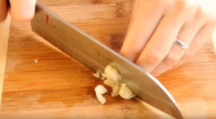 Grind the garlic.