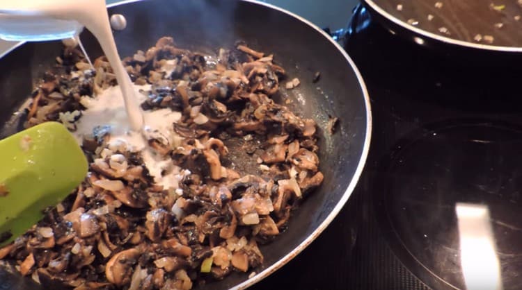 Add garlic to the mushrooms with onions, as well as cream.