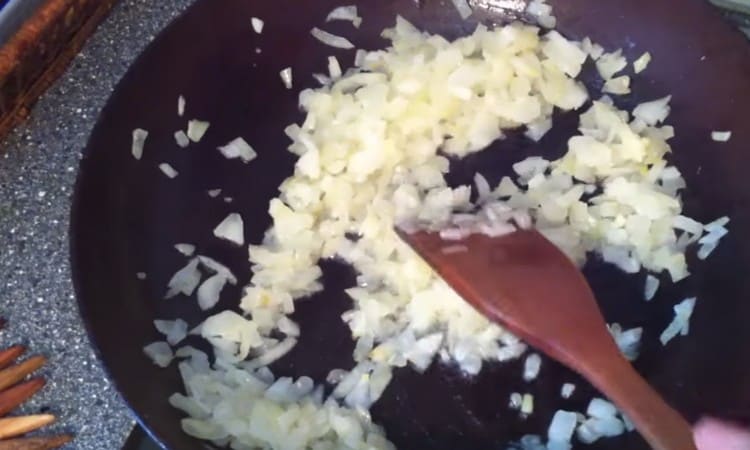 Grind the onion and fry it in a pan.