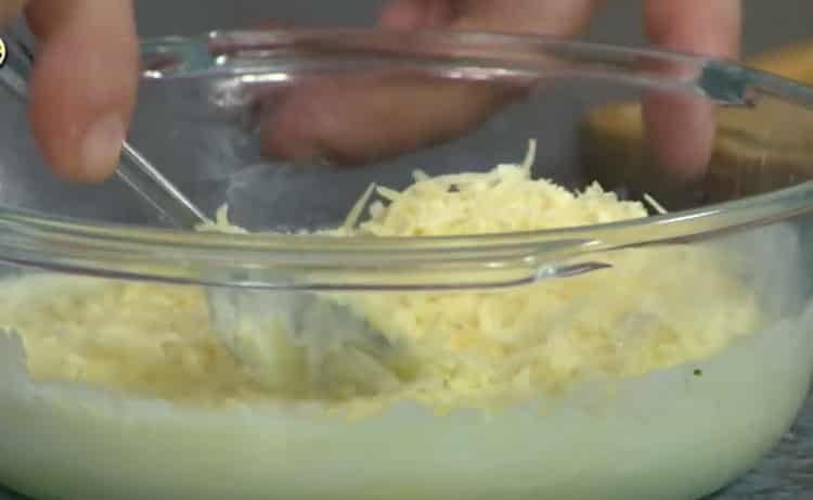 Grate cheese to make noodles