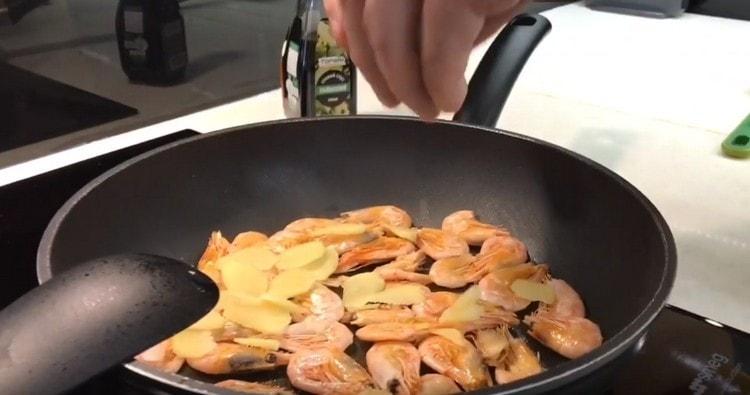 Add the ginger to the shrimp pan.