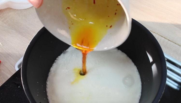 Add saffron diluted in water to cream.