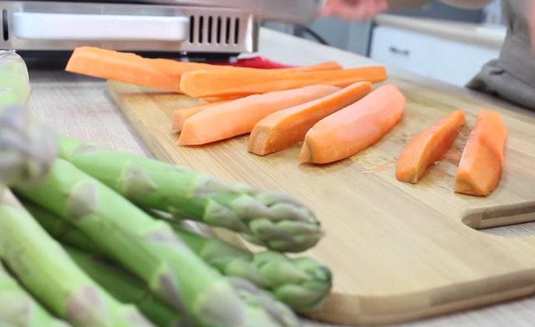 We clean and chop carrots with cubes.