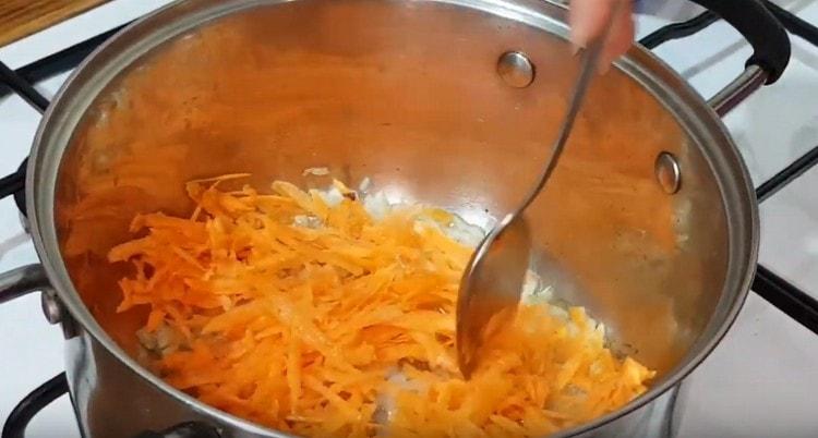 Add carrot to the onion.