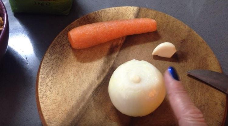 Wash and chop carrots and onions.