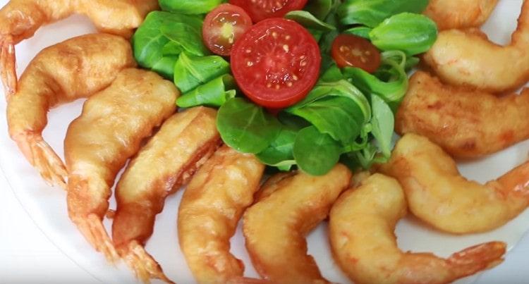 Appetizing shrimp in batter can be served with different sauces.