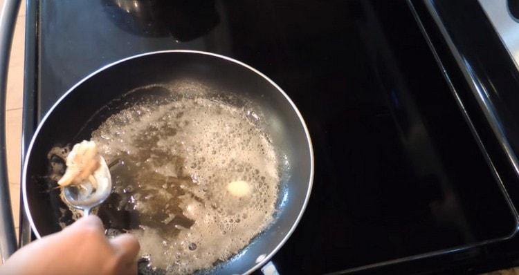 Sauteing garlic. remove it from the pan.