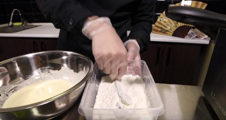 Roll each shrimp in flour.