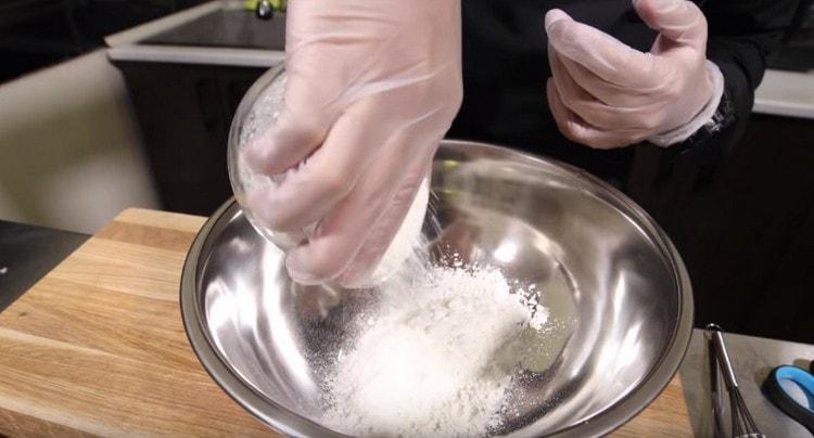 Pour in a bowl tempura flour.