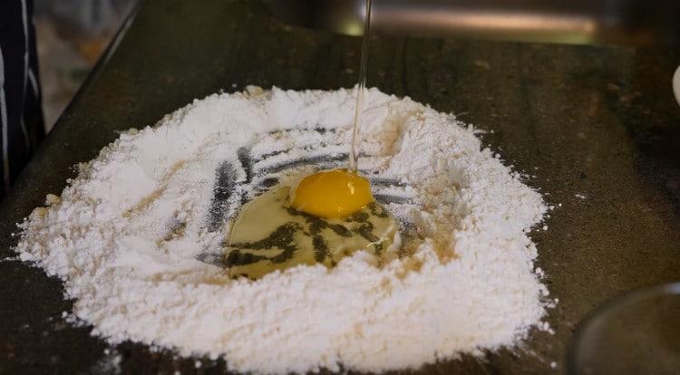 We beat the egg into the flour.