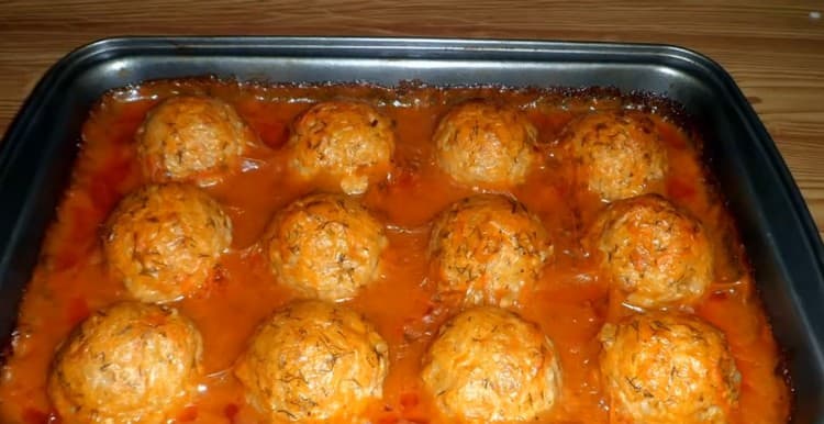 Appetizing chicken meatballs in the oven are ready.