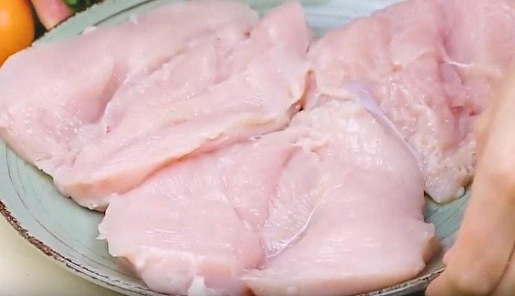 Chicken fillet cut in half, but not completely cut.