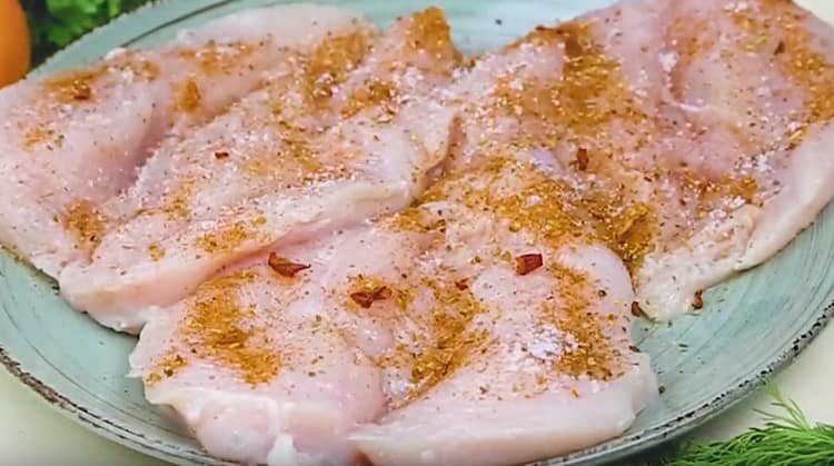 Season chicken with spices.
