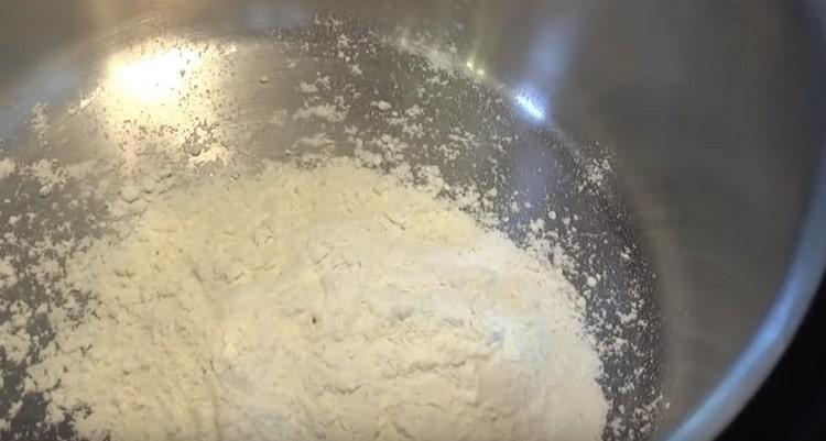 Fry flour in a saucepan.