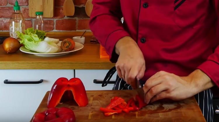 Bulgarian pepper is also cut into strips.