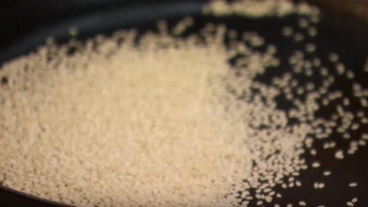 Fry sesame seeds in a dry frying pan.