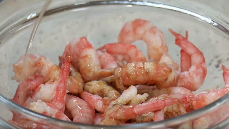 Marinate shrimp in soy sauce and sesame oil.