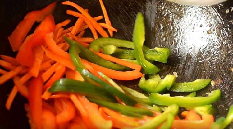 Add the bell pepper to the carrots.