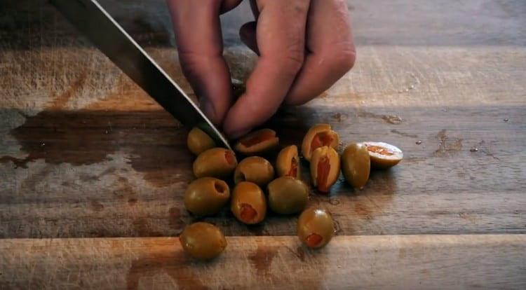 Halve the olives.