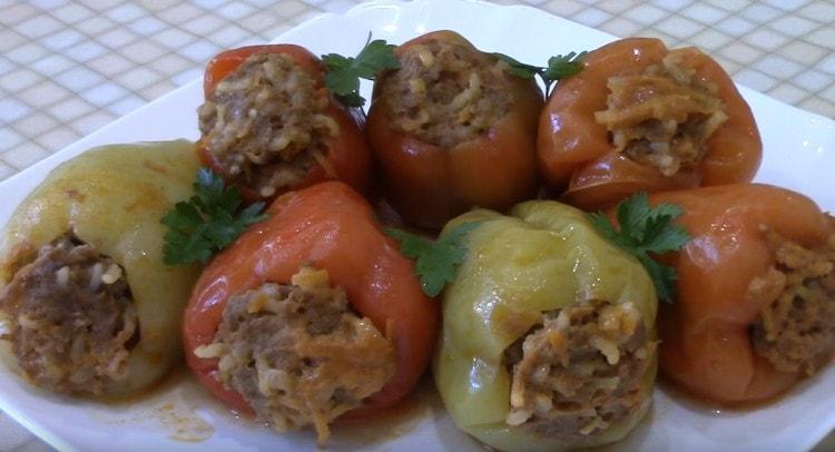 Peppers stuffed with meat and rice are juicy, aromatic and hearty.