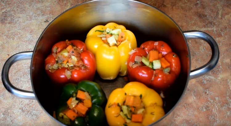 put stuffed peppers in a pan.