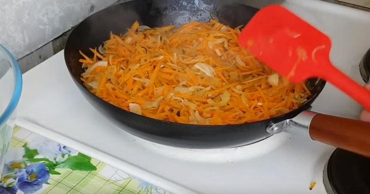 Add carrots to the onion.